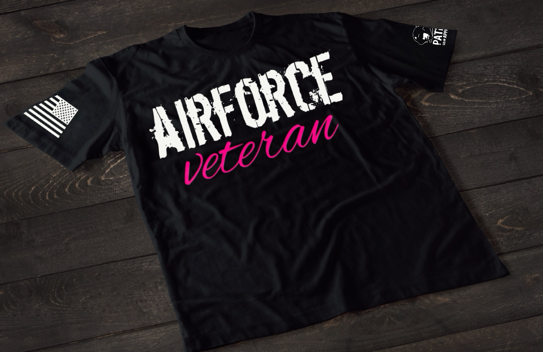 Black Air Force Veteran women’s T-shirt featuring bold white and pink military service text graphic design on the front