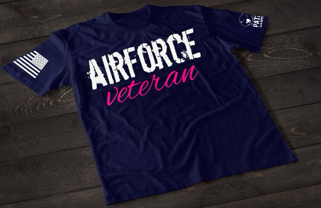 Navy Blue Air Force Veteran women’s T-shirt featuring bold white and pink military service text graphic design on the front