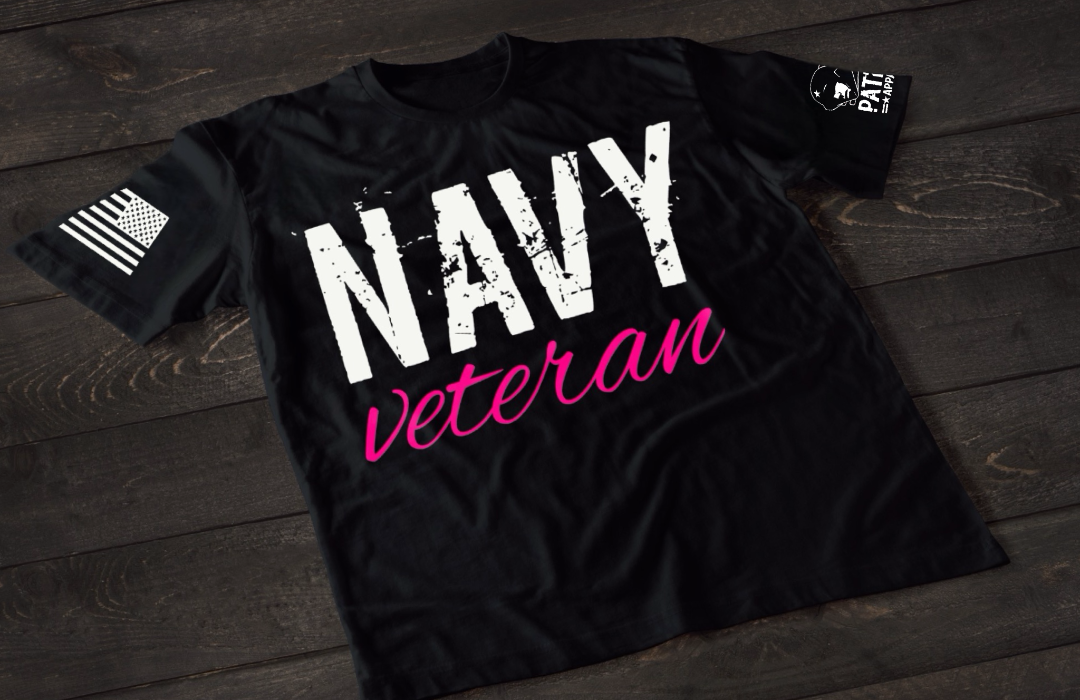 Black Navy Veteran women’s T-shirt featuring bold white and pink military service text graphic design on the front