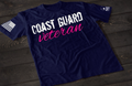 Navy Blue Coast Guard Veteran women’s T-shirt featuring bold white and pink military service text graphic design on the front